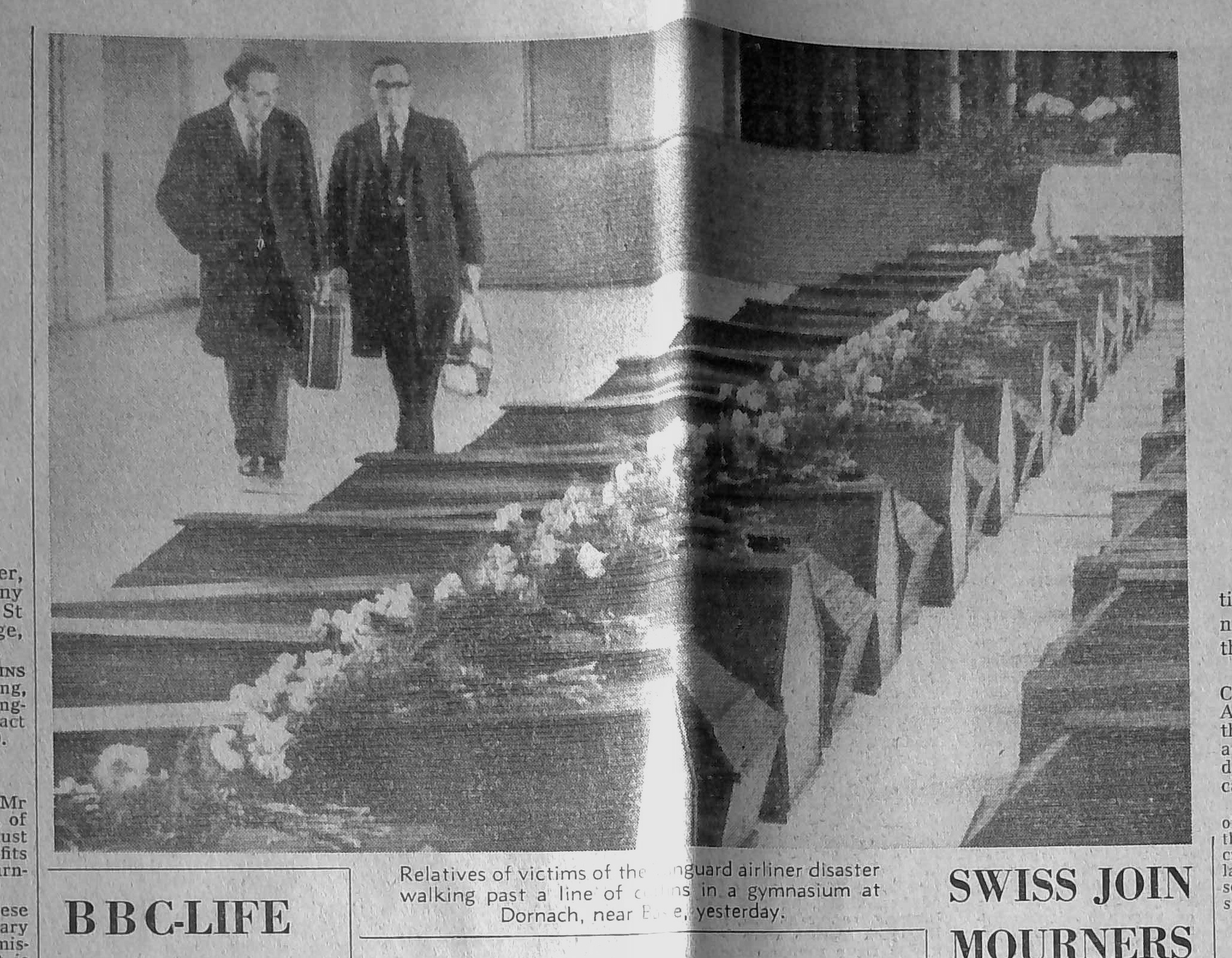 SWISS JOIN MOURNERS IN CHURCH